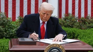 Us president donald trump signing an executive ord 1743660977599 1743660986009